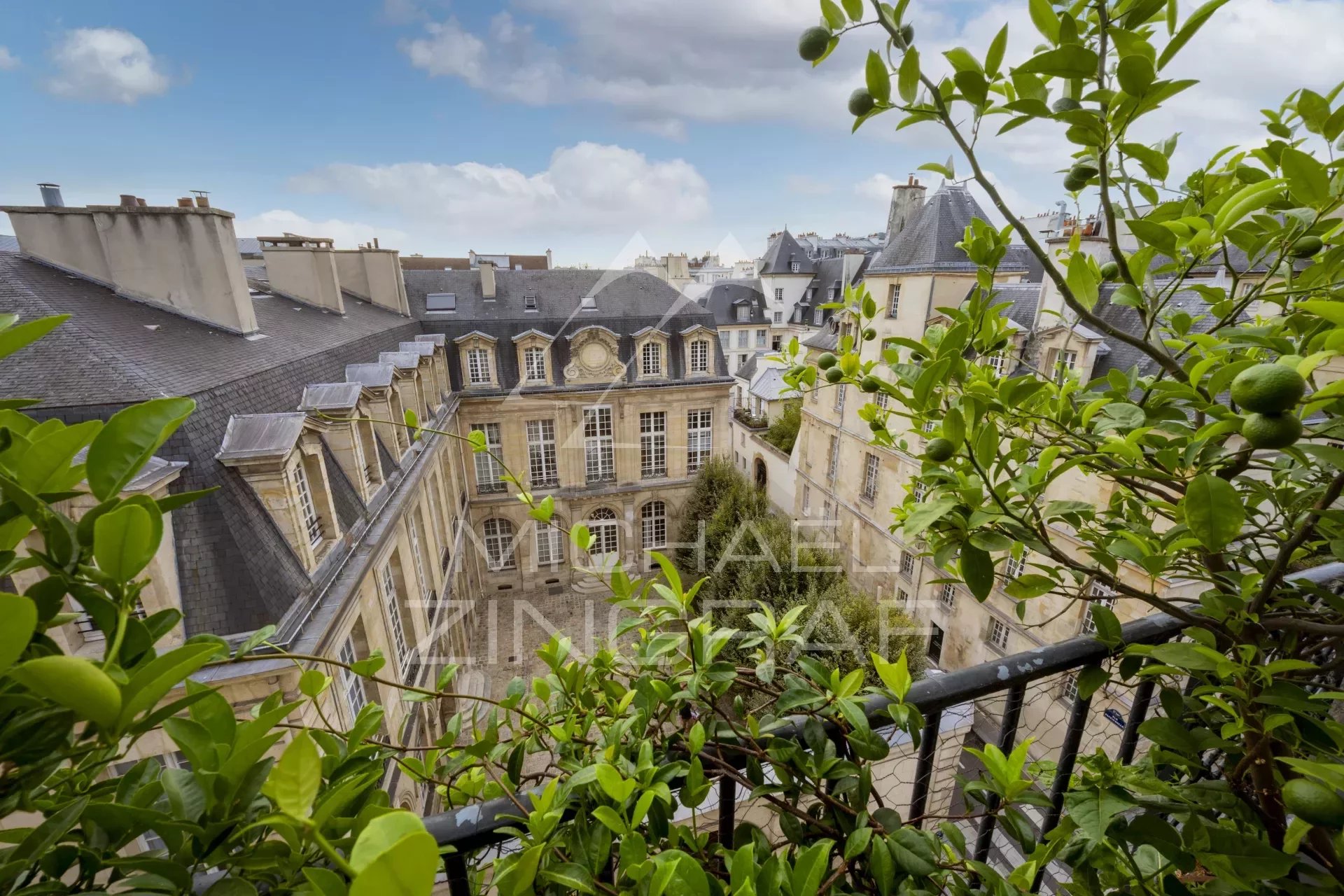 Charming top floor in the heart of the Marais Rue des Archives with a view of a private mansion