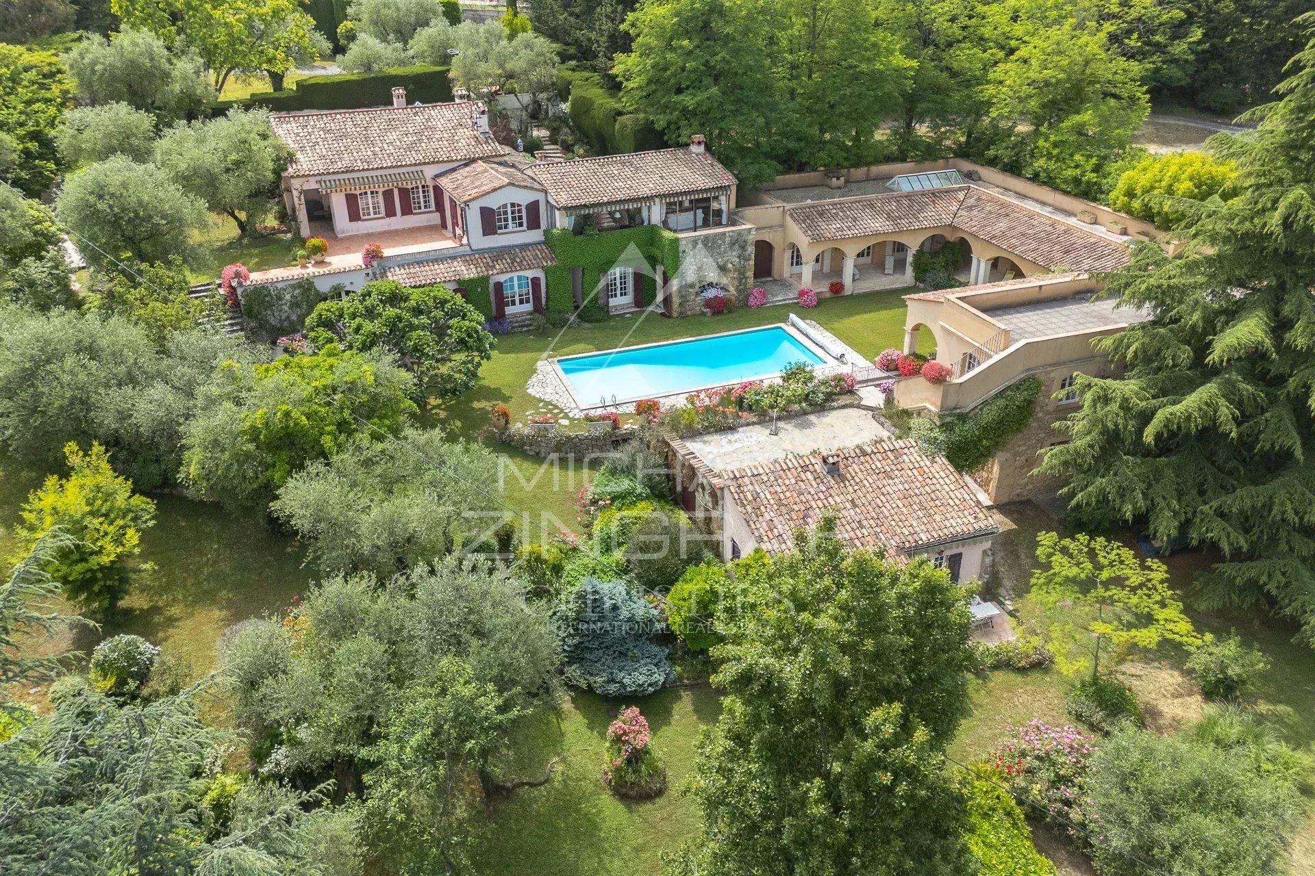 Exceptional estate with private woodland, landscaped grounds, tennis court, and open views