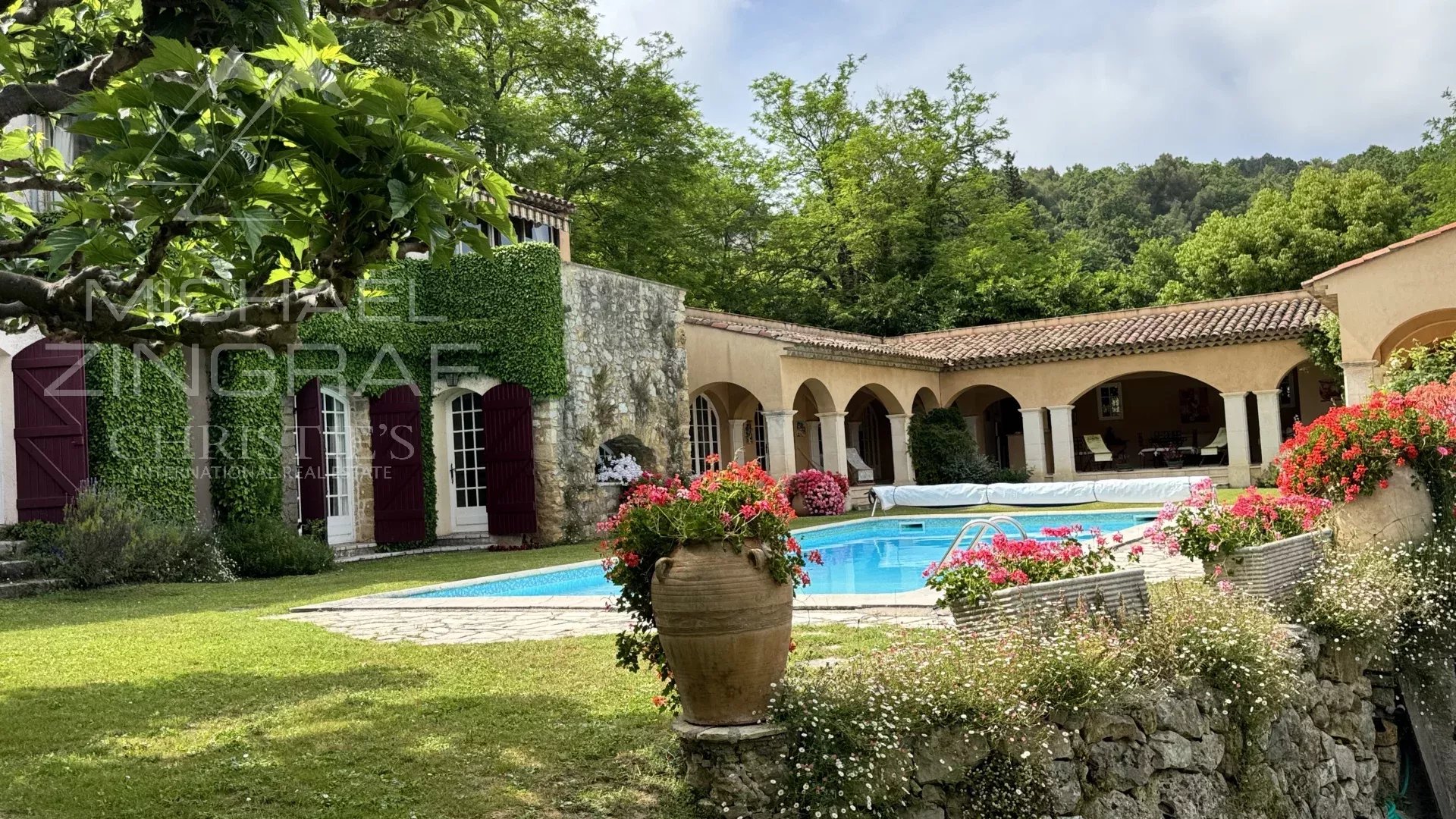 Exceptional estate with private woodland, landscaped grounds, tennis court, and open views