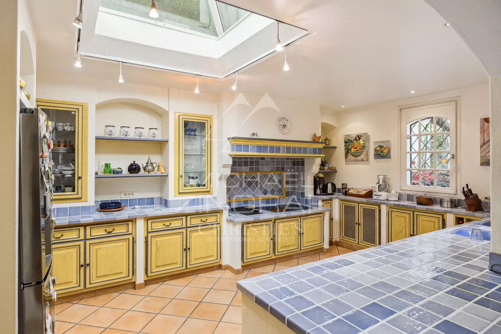 Exceptional estate with private woodland, landscaped grounds, tennis court, and open views