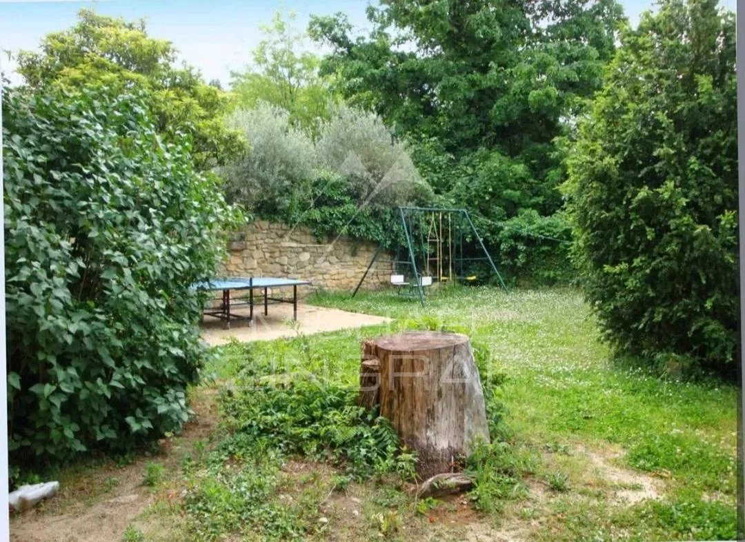 Close to Uzès : In the heart of a village, beautiful property with outbuildings