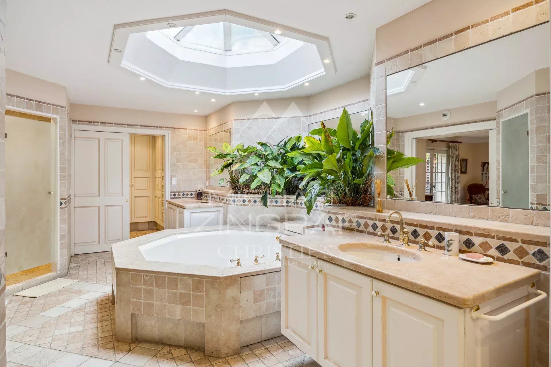 Exceptional estate with private woodland, landscaped grounds, tennis court, and open views